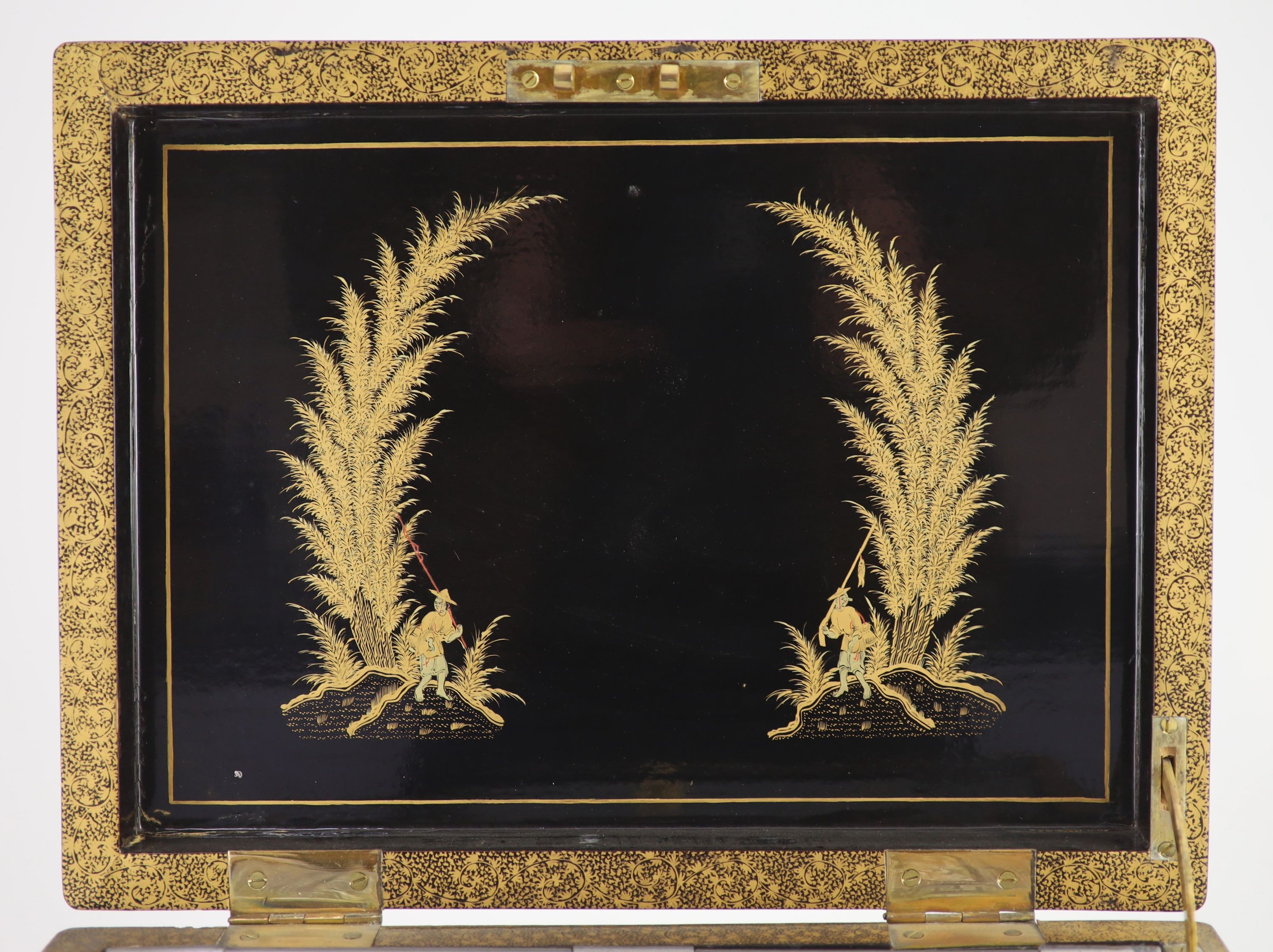 A Chinese export gilt decorated black lacquer tea chest, early 19th century, 35 cm wide, including side carrying handles